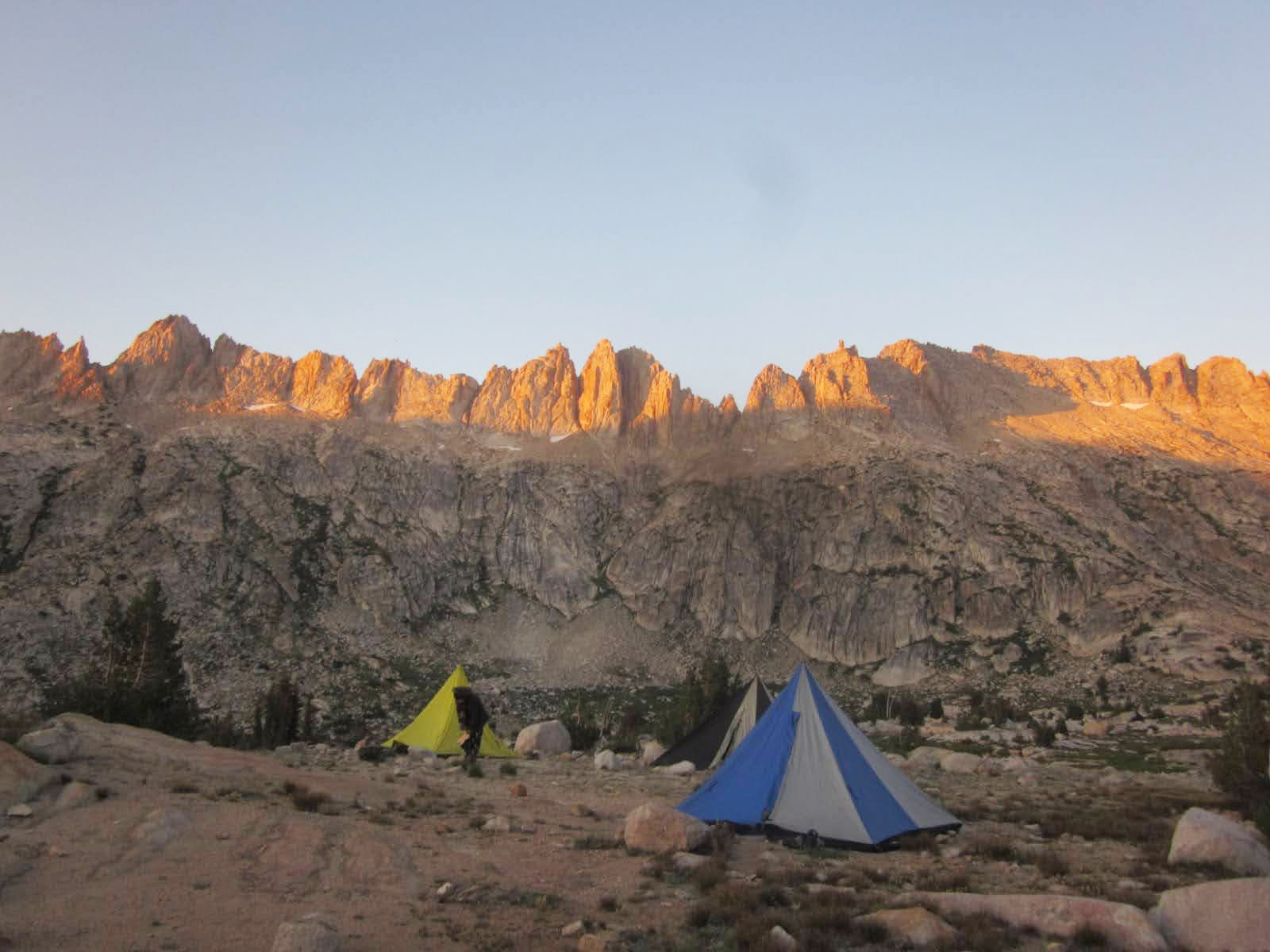 Colorful tents set up among a rocky landscape