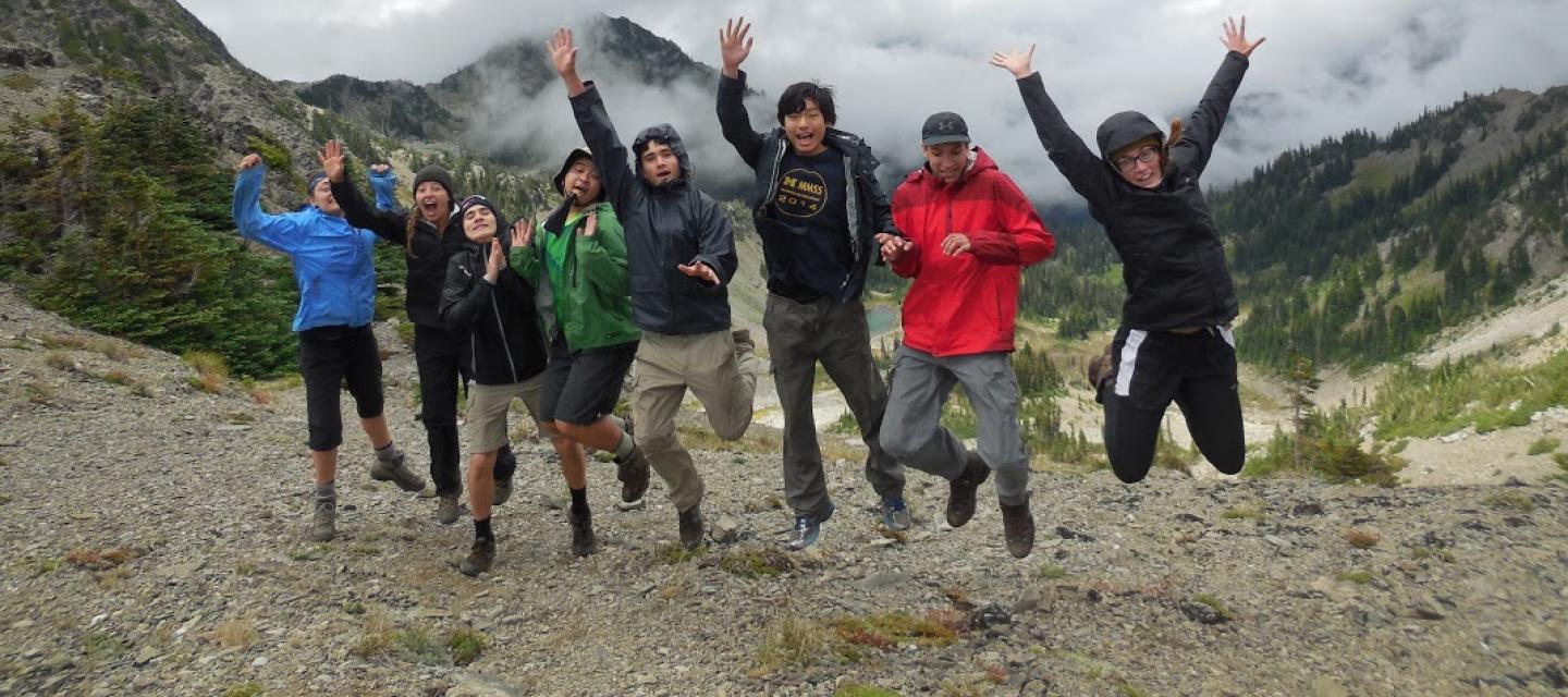 Student jump at the top of Gray Wolf Pass