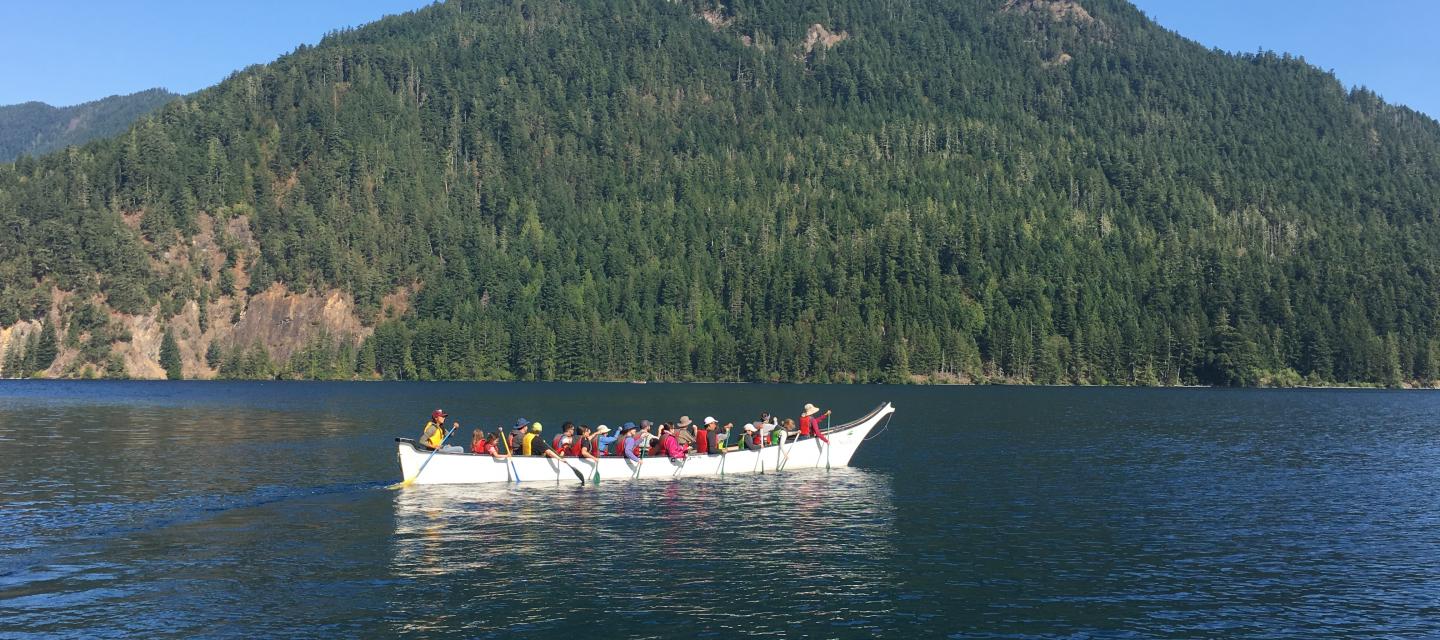 Families enjoying a canoe ride on Lake Crescent