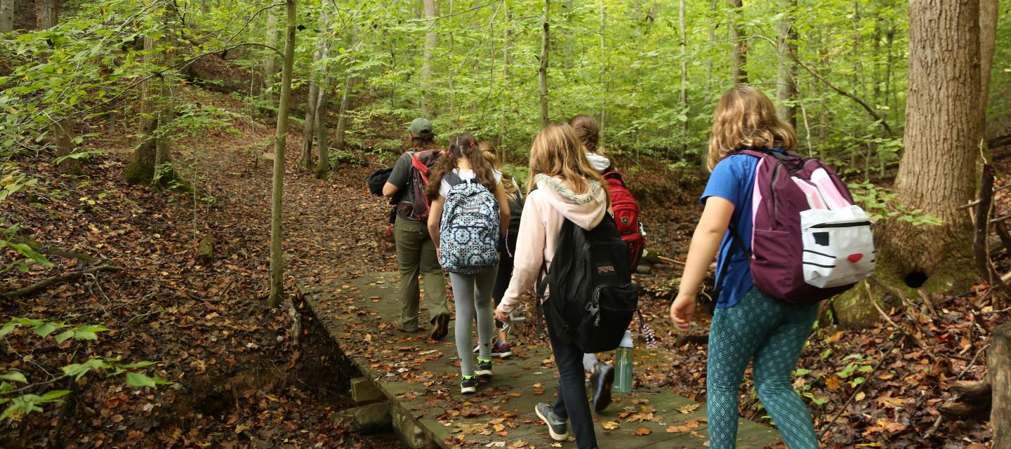 Students hiking through Prince William Forest Park on a NatureBridge school program