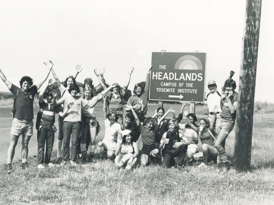 NatureBridge students and staff pose next to the Headlands Institute sign in 1977.
