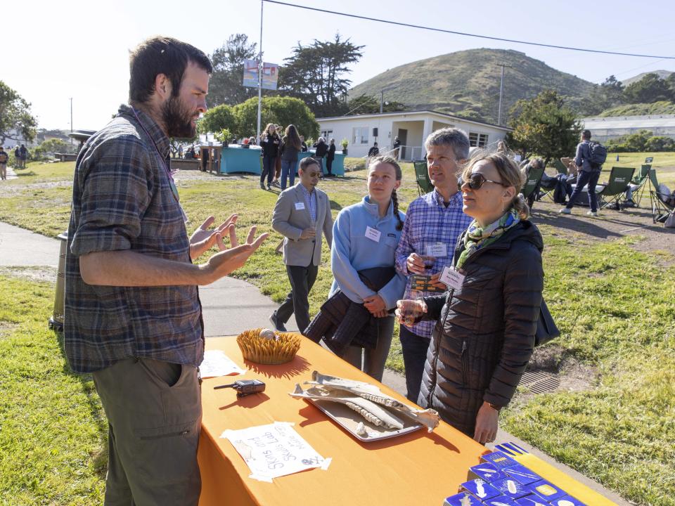 Guests at learning stations at An Evening Outside 2023