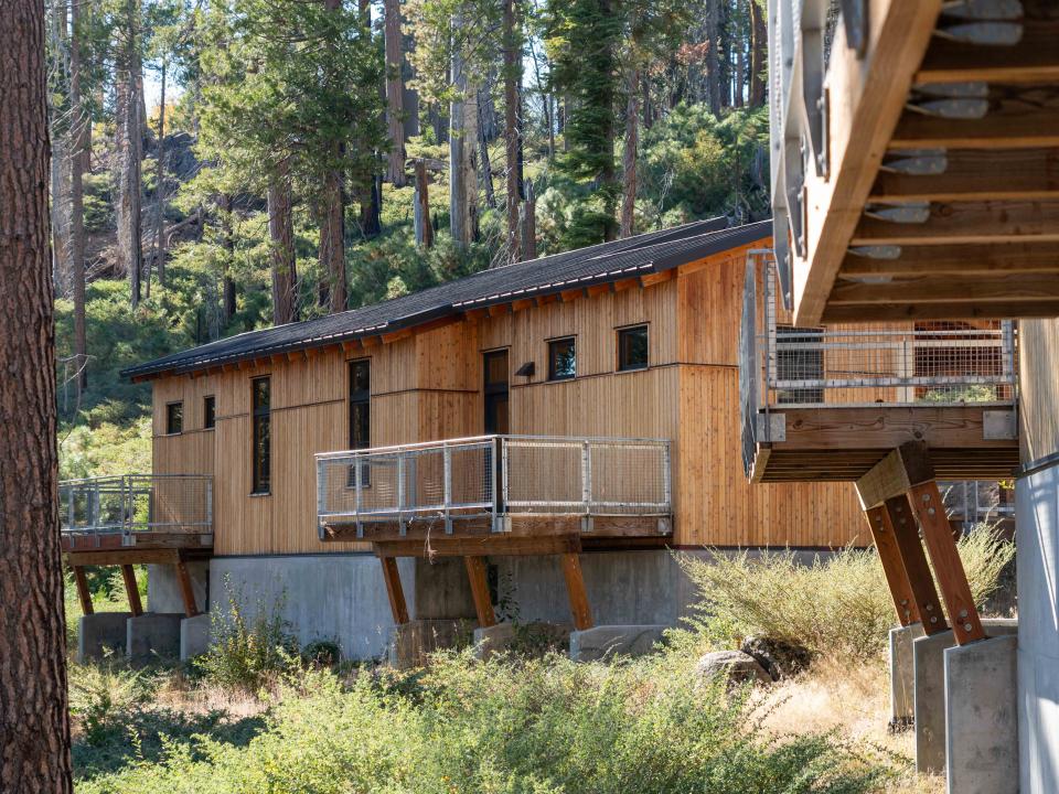 Exterior view of the cabins at the National Environmental Science Center each with two balconies providing a bird's eye view of the surrounding landscape.