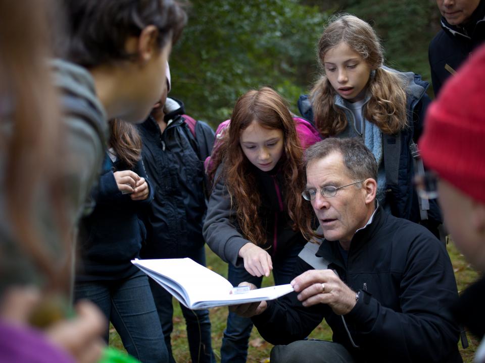 NatureBridge educator guides students as they investigate the natural world