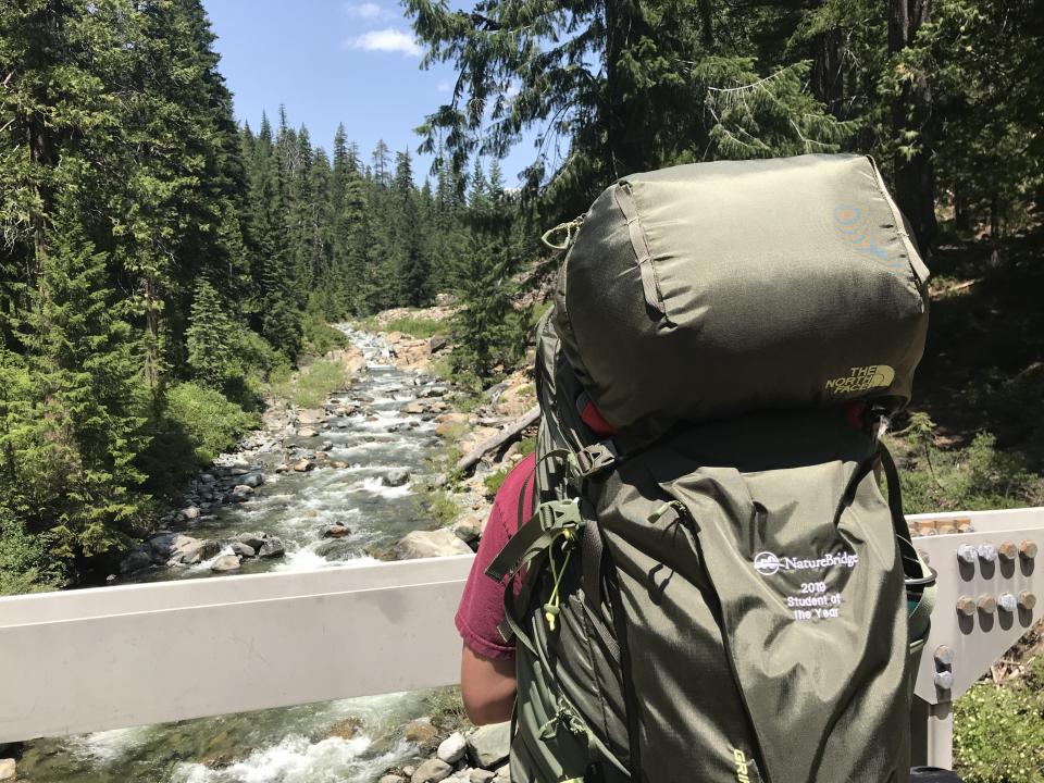 Kinzie backpacking with her Student of the Year NatureBridge backpack.