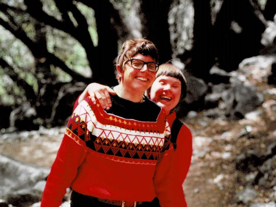two people in red in yosemite laughing