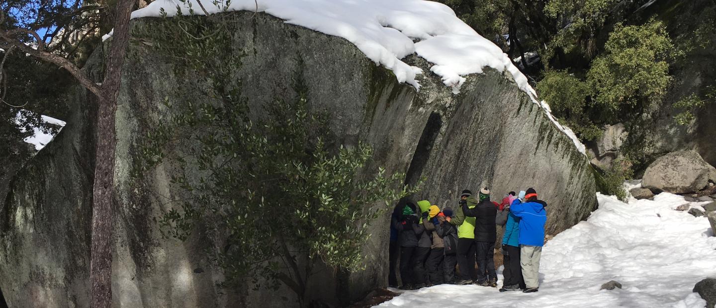 Students exploring a rock hole in Yosemite