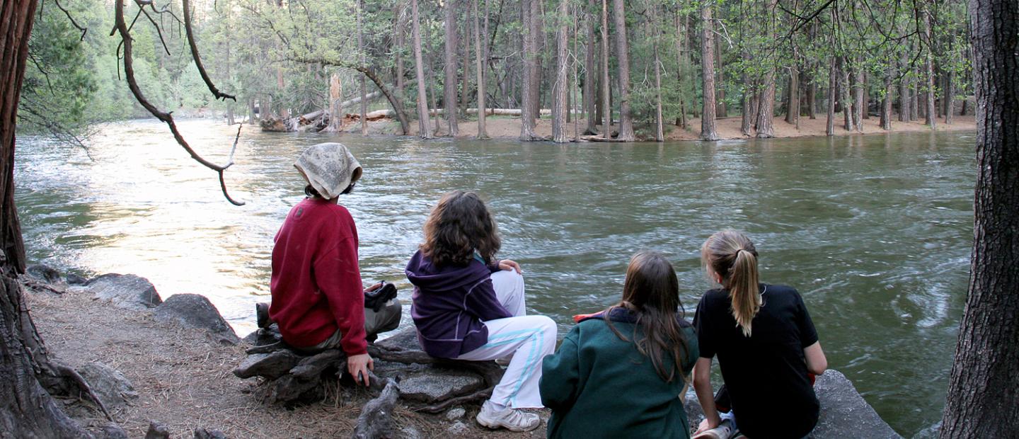 Joni and her classmates on the shore of the Merced River.