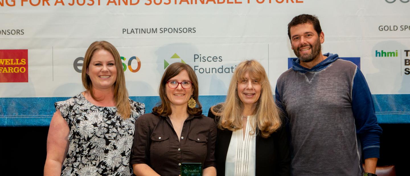 Estrella (second from left) receives award for AEOE. Photo courtesy of NAAEE conference photographer Melissa Blackwell.